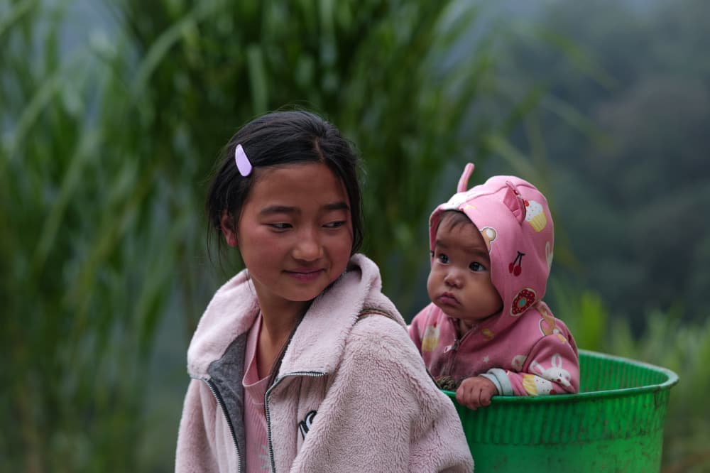 Smiling Girl and Baby by HuongHoang — canvas wall art