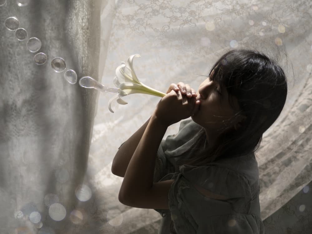 Girl Blowing Lily Bubbles by Takako Ugachi — canvas wall art