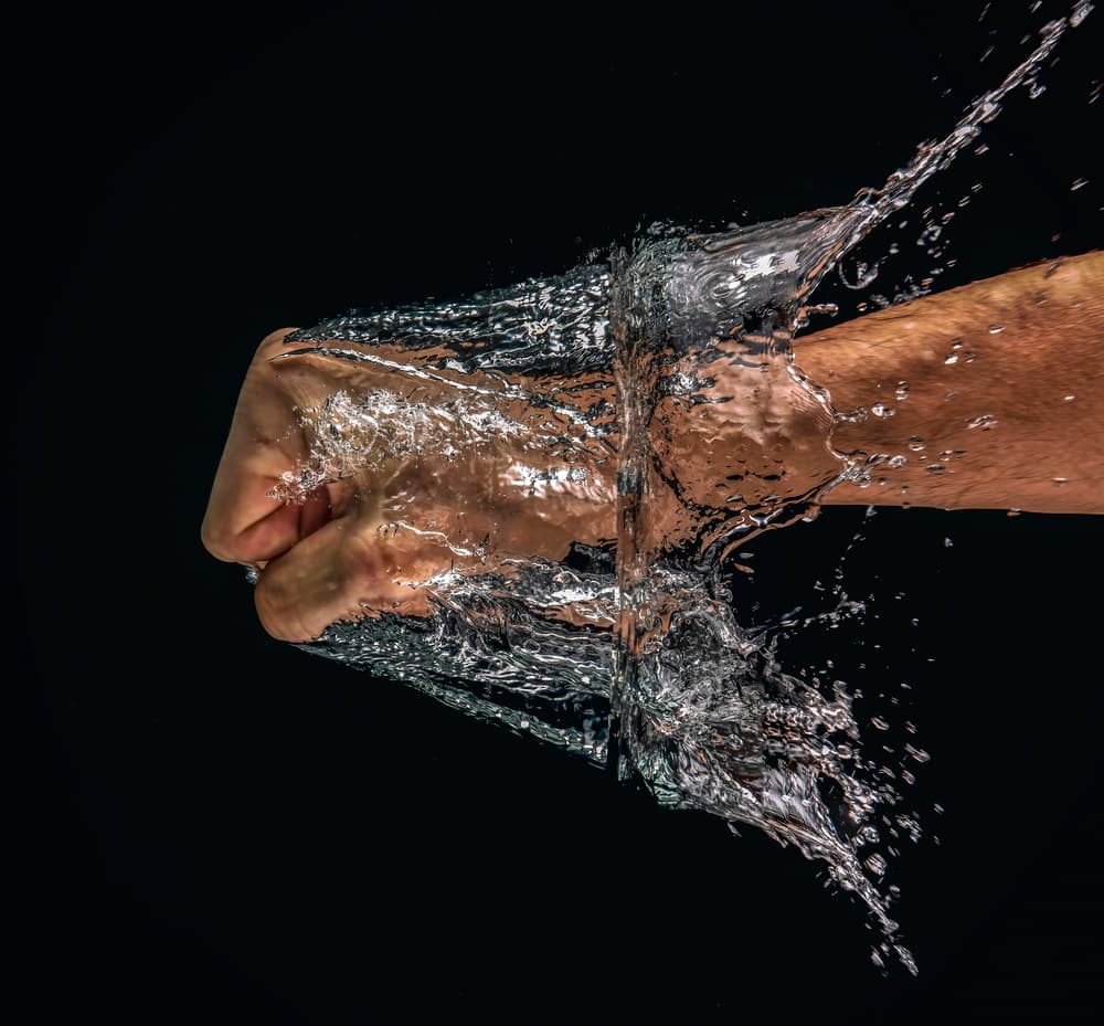Fist Punching Water by Chris Coenders — canvas wall art