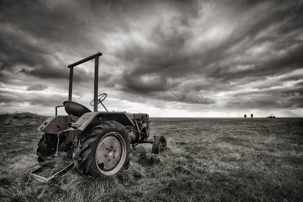 Old Tractor Stormy Sky by Þorsteinn H. Ingibergsson — canvas wall art