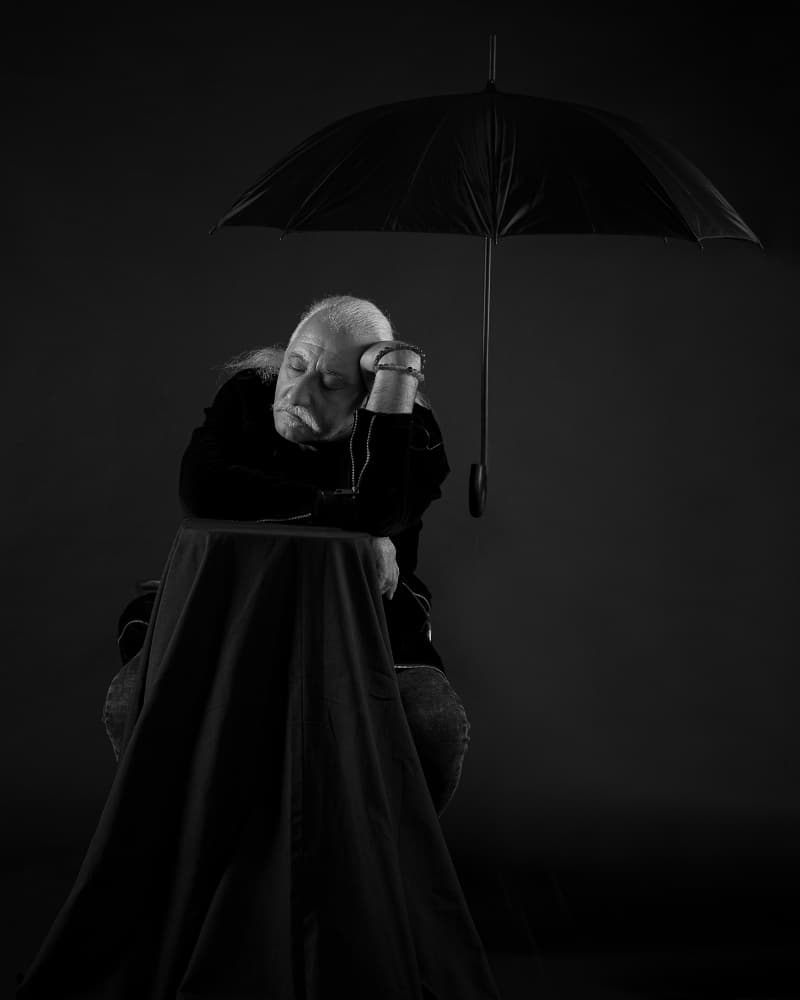 Pensive Man Under Umbrella by Aneta Nikolova — canvas wall art