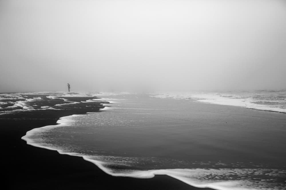 Lone Figure Misty Beach by Liesbeth van der Werf — canvas wall art