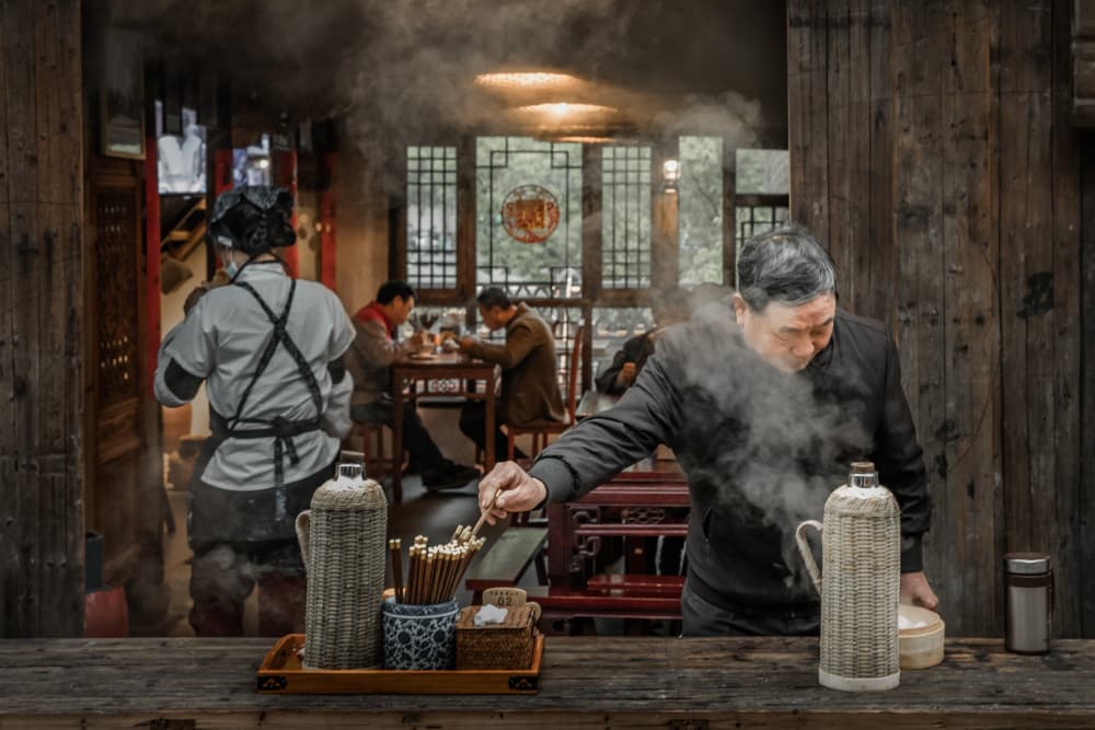 Man Serving Hot Tea by Li Ying — canvas wall art