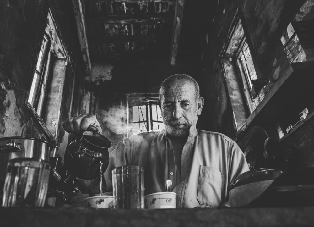 Man Pours Steaming Tea by Hesham Ragab — canvas wall art