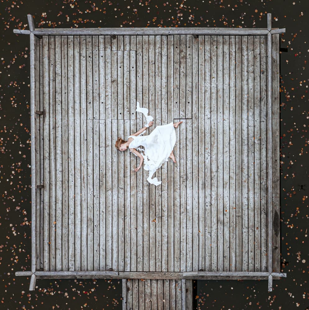 Dreamy Woman on Dock by Mike Kreiten — canvas wall art