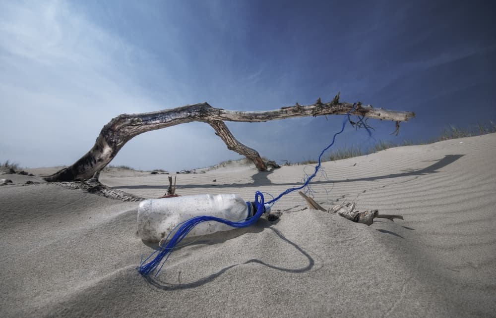 Plastic Bottle Beach by Leon — canvas wall art