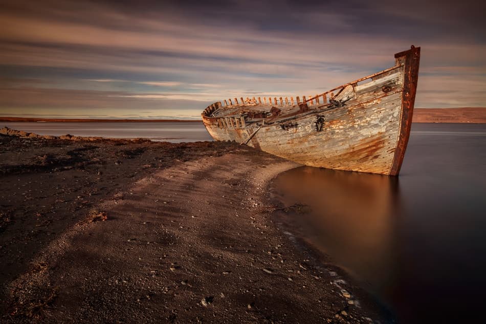 Rustic Shipwreck Beach Sunset by Bragi Ingibergsson - BRIN — canvas wall art