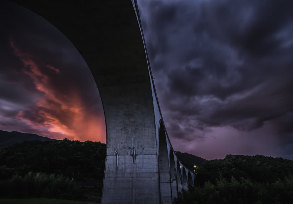 Fiery Sky Over Bridge by Hiroaki Ikeshita — canvas wall art