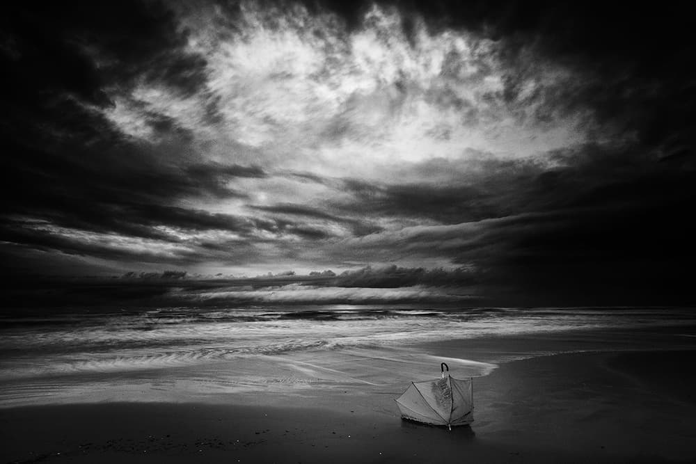 Stormy Beach Umbrella by Massimo Della Latta — canvas wall art