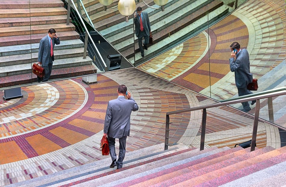Businessman On Mirrored Stairs by Izidor Gasperlin — canvas wall art
