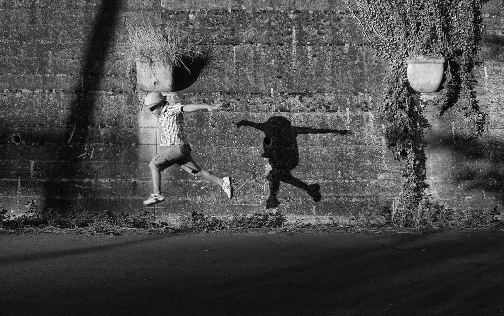 Jumping Boy Shadow by Carlo Ferrara — canvas wall art