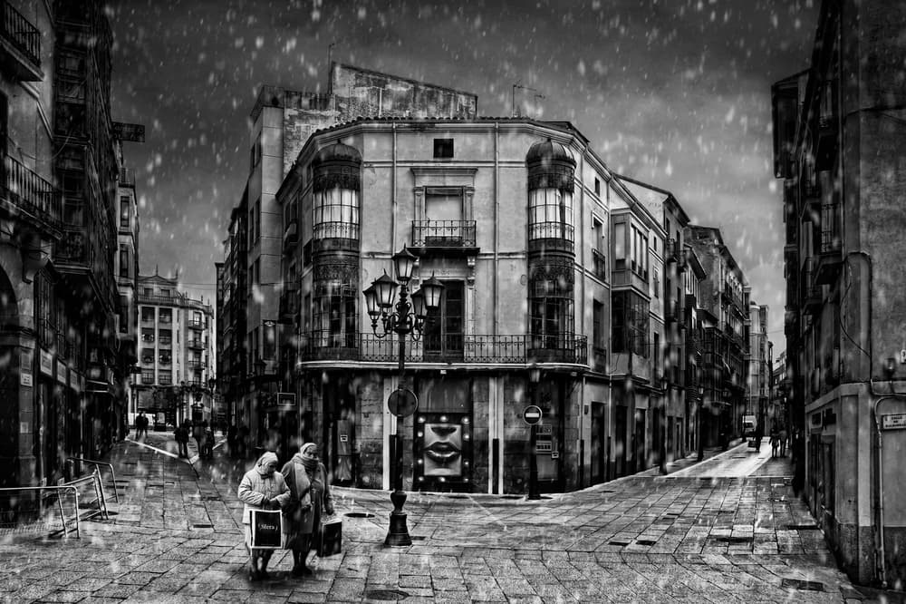 Snowy Old City Street by Jose C. Lobato — canvas wall art