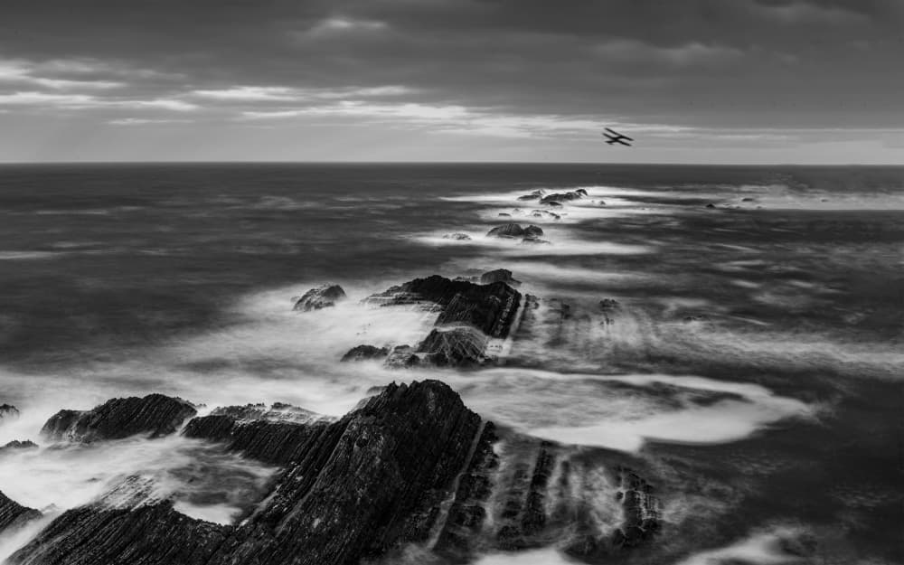 Biplane Over Rocky Coast by Lian Tang — canvas wall art