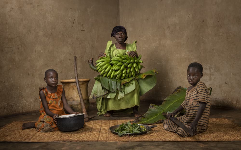 African Family Preparing Food by Matt Jacob — canvas wall art