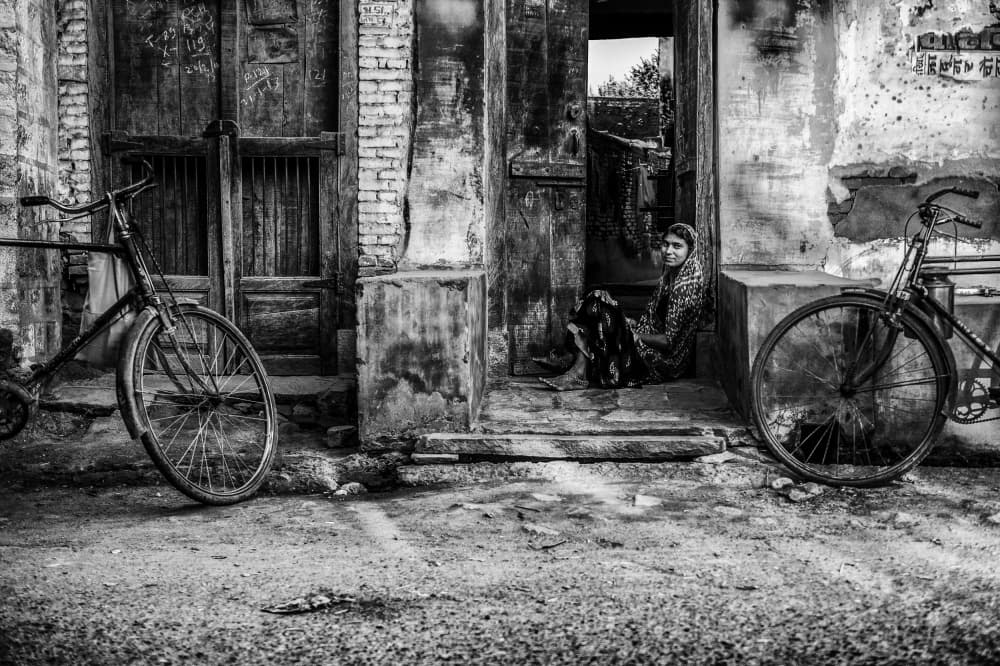 Woman In Old Doorway by Mohammed Alnaser — canvas wall art