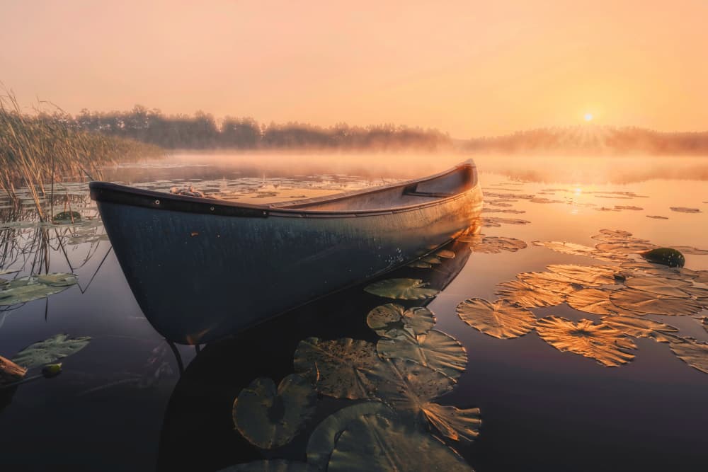 Sunrise Canoe on Lake by Dariusz Budyta — canvas wall art