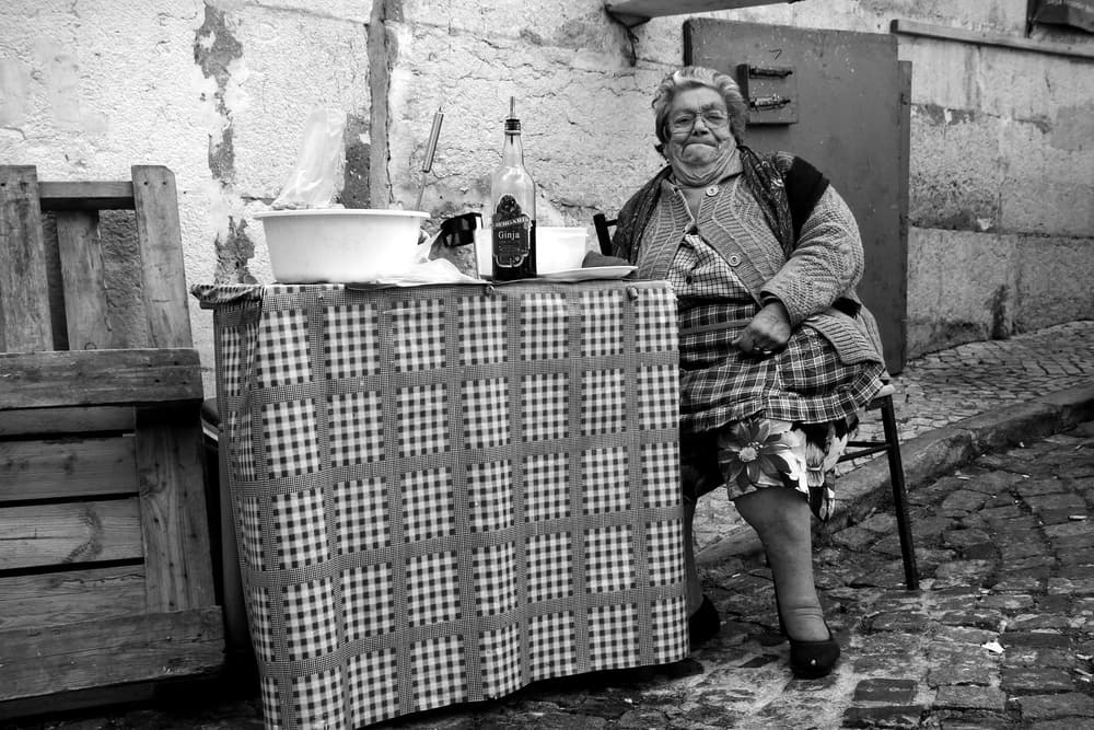 Old Woman Street Vendor by Fernando Alves — canvas wall art