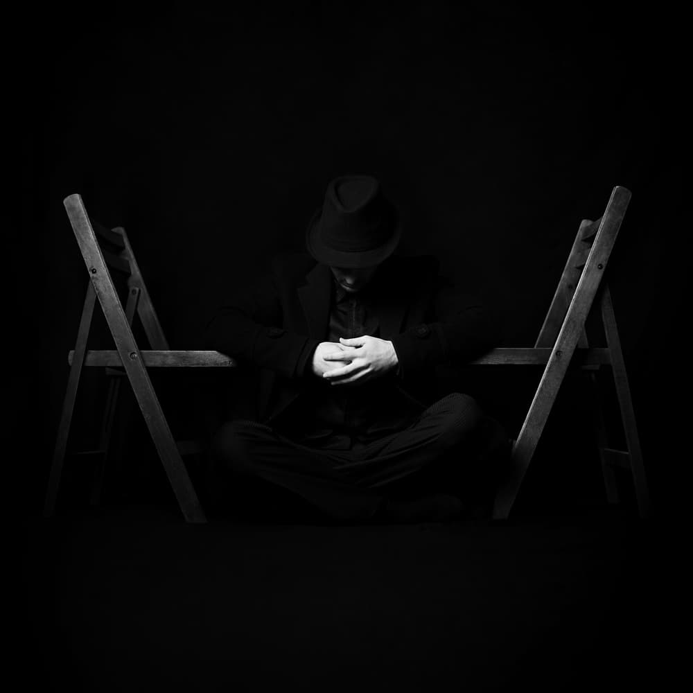 Pensive Man Sitting by Bobby Kostadinov — canvas wall art