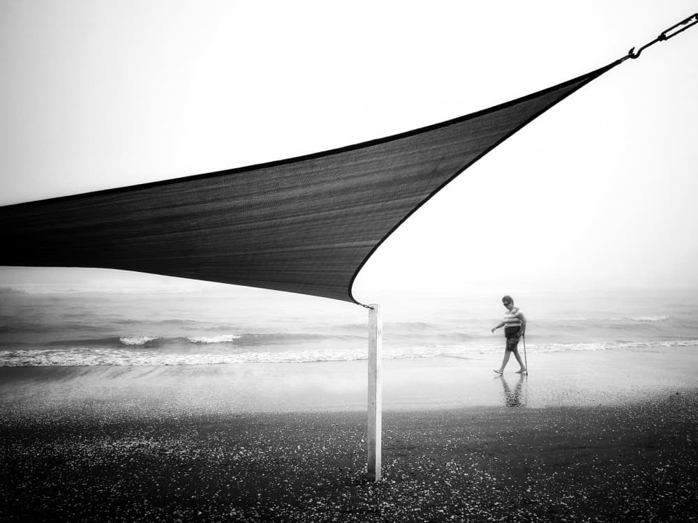 Misty Beach Walk by Emilian Avramescu — canvas wall art