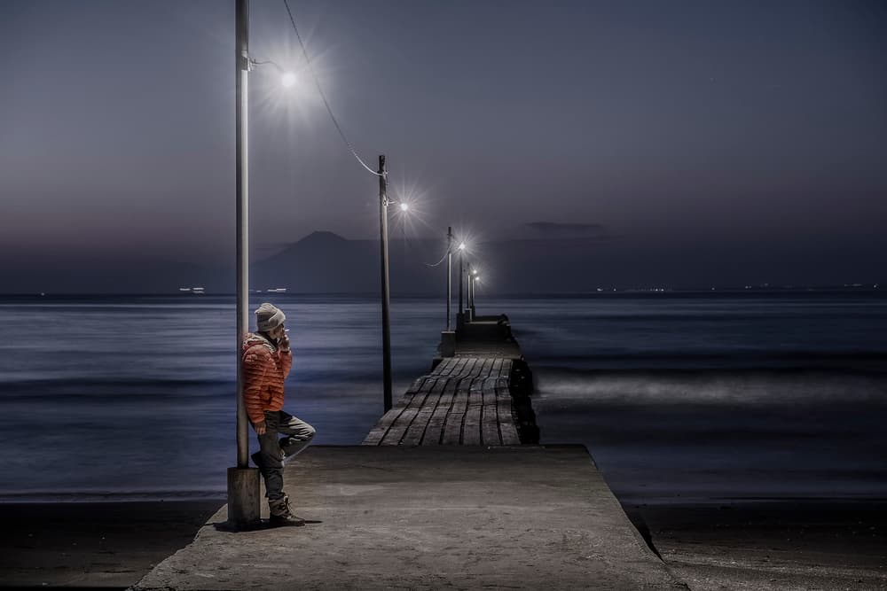 Man on Pier at Night by Tomoshi Hara — canvas wall art