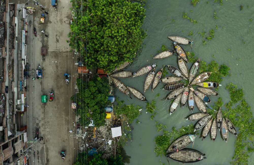 Busy River Market by Anindita Roy — canvas wall art