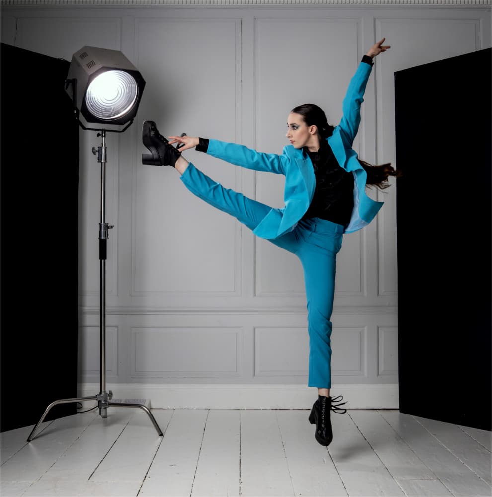 Dynamic Teal Suit Jump by Derwood — canvas wall art