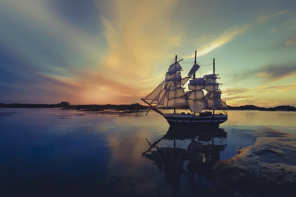 Serene Sailing Ship Sunset by Sharon Levy — canvas wall art