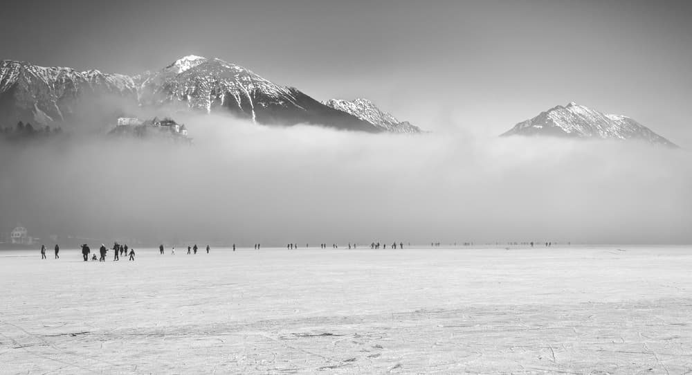 Misty Mountains Ice Skating by Ales Krivec — canvas wall art