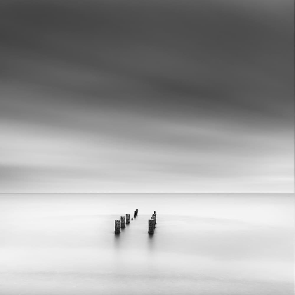 Still Ocean Pilings by George Digalakis — canvas wall art