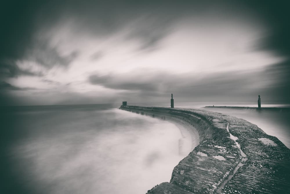 Moody Curved Pier Seascape by Keren Or — canvas wall art
