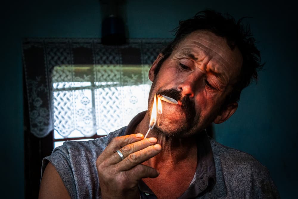 Man Lighting Cigarette by Vlad Paulet — canvas wall art