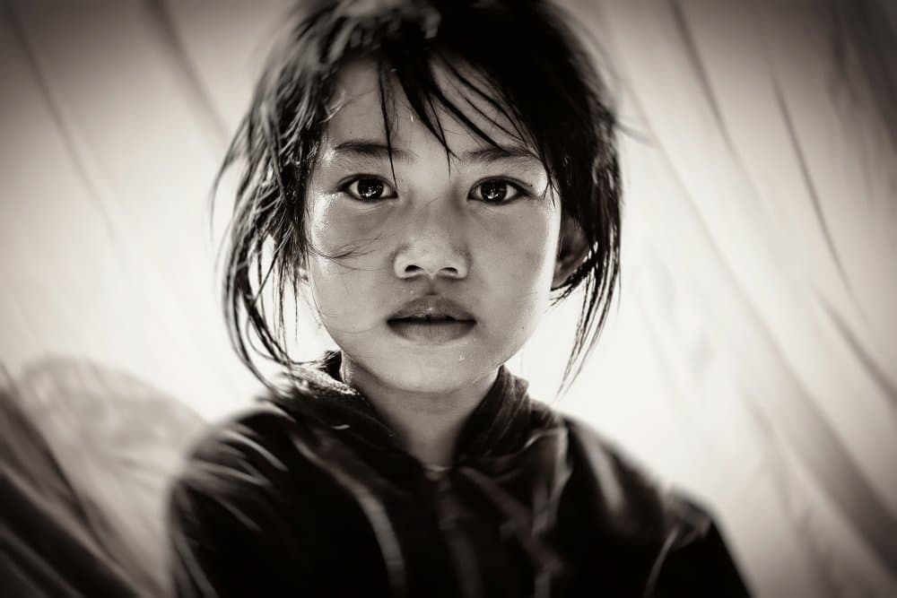 Pensive Asian Child by Gloria Staffa — canvas wall art