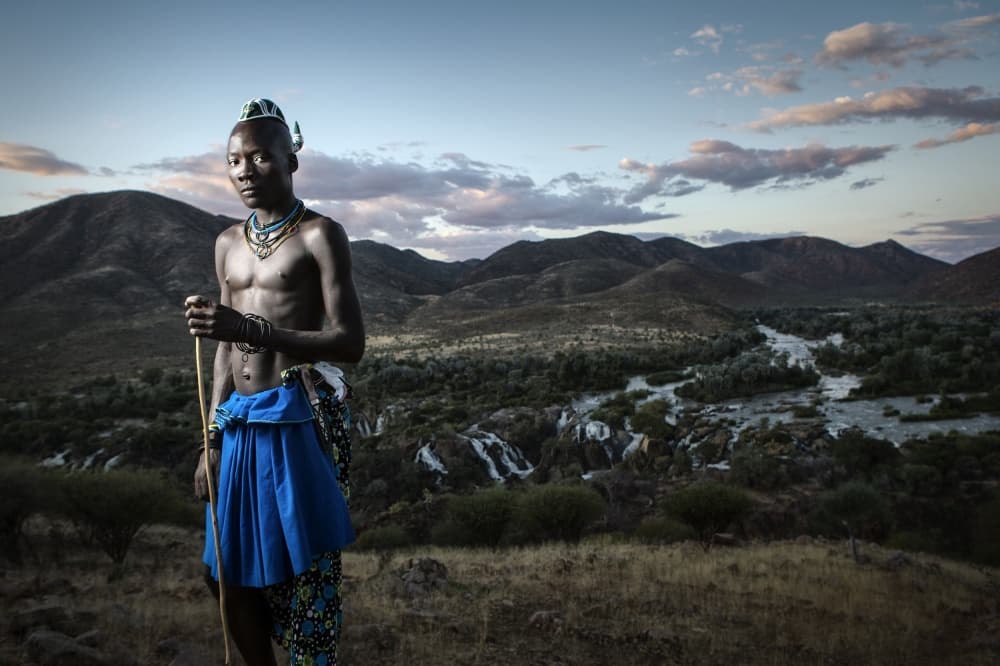 Himba Man Epupa Falls by Ben McRae — canvas wall art