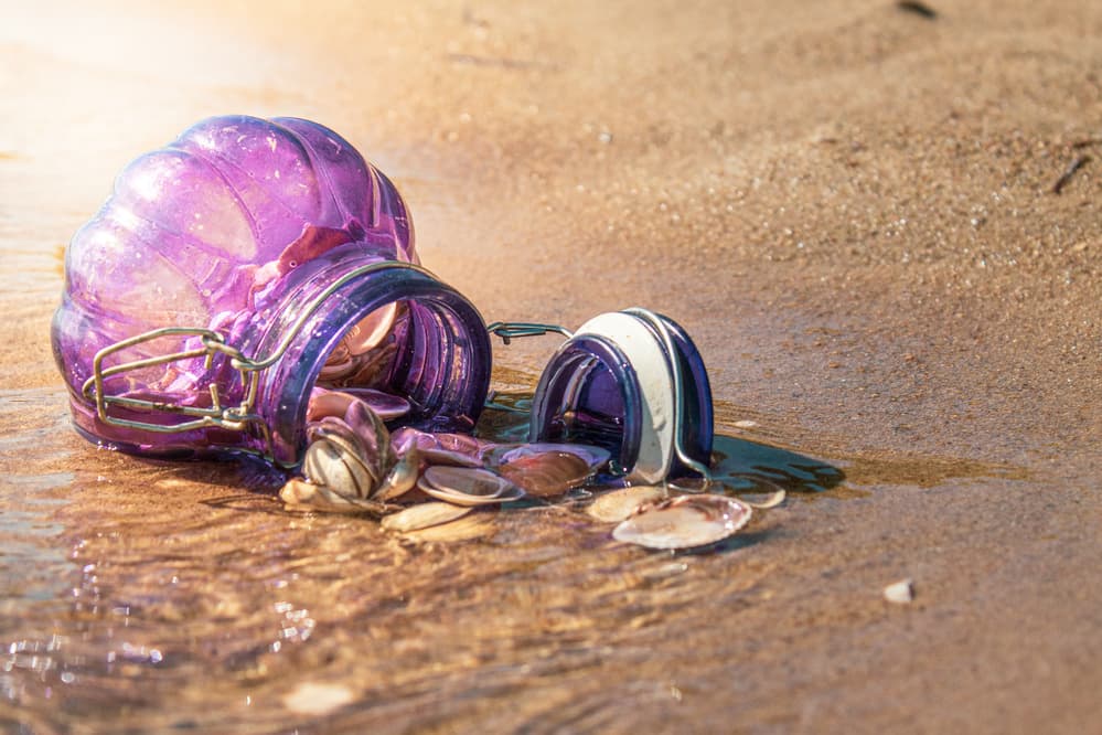 Purple Jar on Sandy Shore by Cicek Kiral — canvas wall art