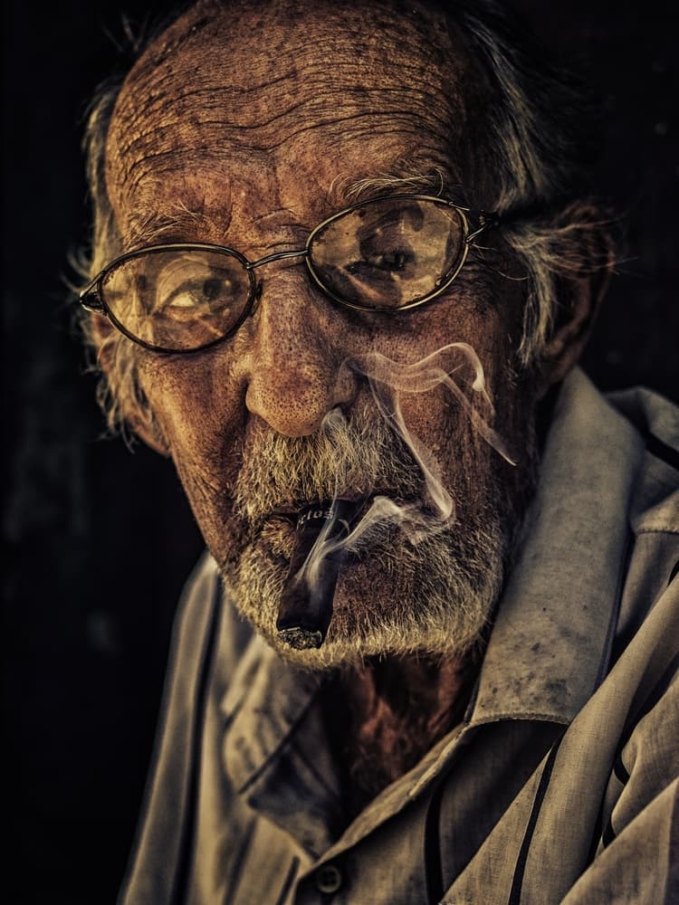Elderly Man Smoking Cigar by Pavol Stranak — canvas wall art