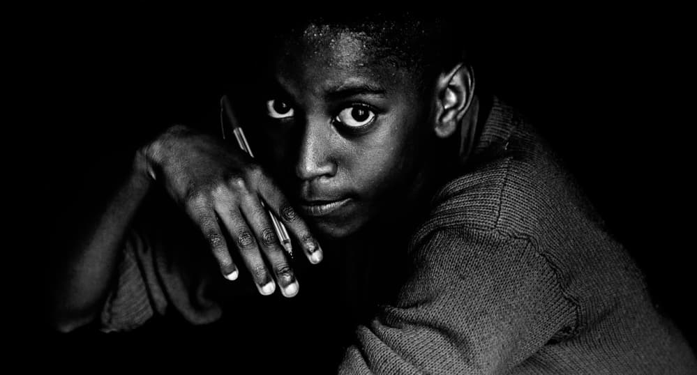 Black Boy Intense Gaze by Vedran Vidak — canvas wall art