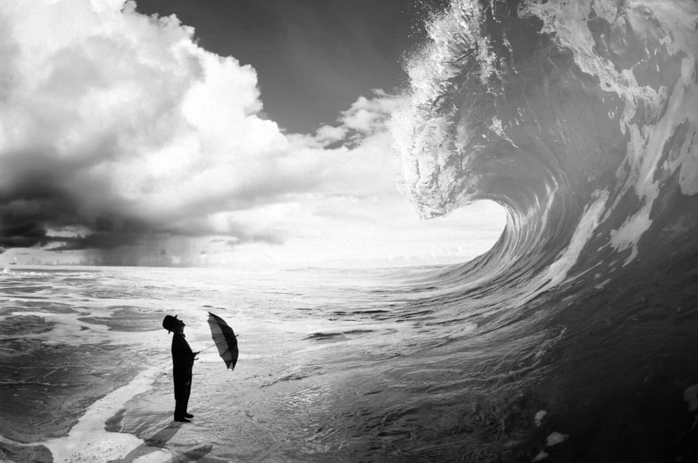 Man Faces Crashing Wave by Pristine Clothes — canvas wall art