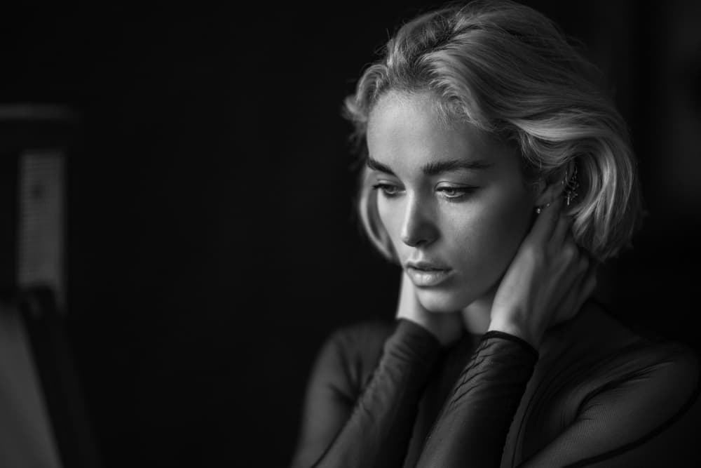 Pensive Blonde Woman by Chris Bos — canvas wall art