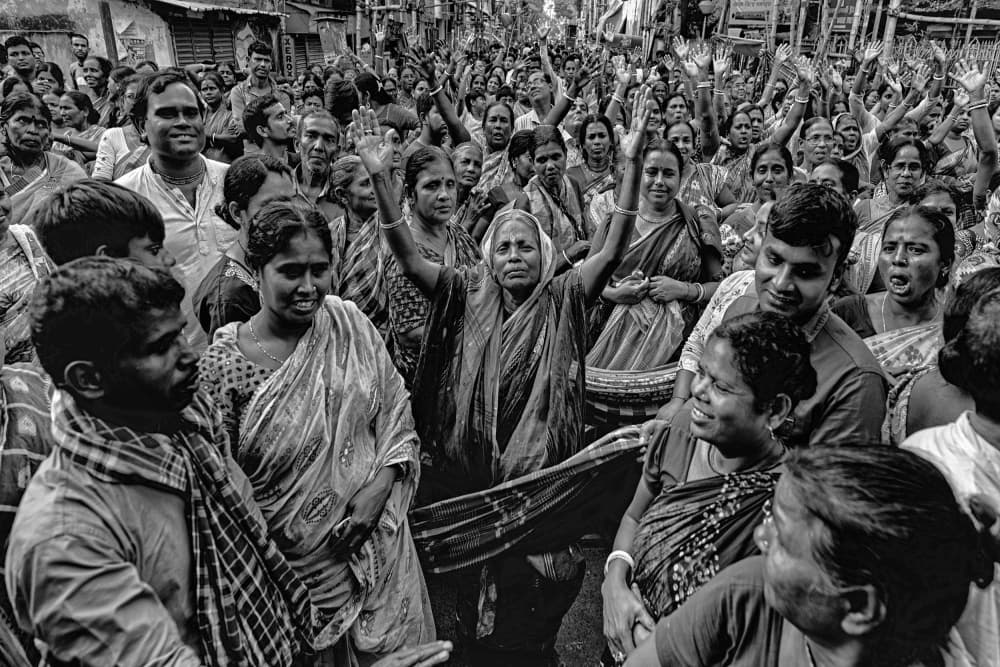 Indian Women Raise Hands by Shaibal Nandi — canvas wall art