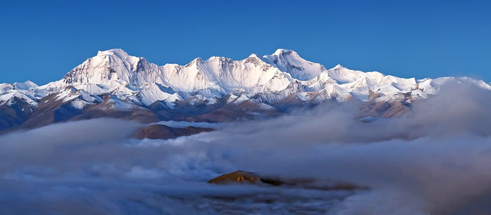 Majestic Mountains Above Clouds by Milan Riha — canvas wall art