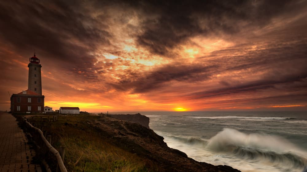Dramatic Lighthouse Sunset by Gonçalo Capitão — canvas wall art