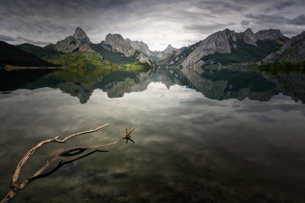 Tranquil Mountain Lake Reflections by Oskar Baglietto — canvas wall art