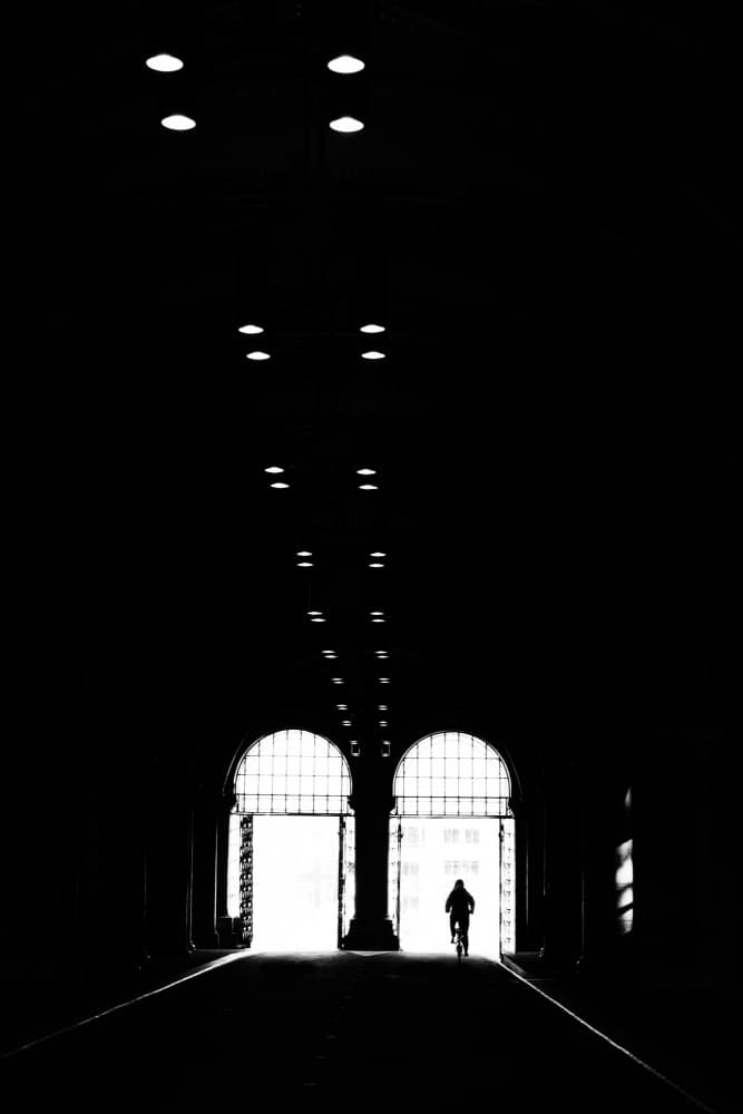 Cyclist Through the Arch by Seray AK — canvas wall art