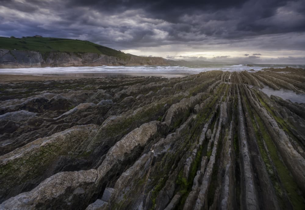 Dramatic Coastal Rock Layers by Josema Martin Espinar — canvas wall art