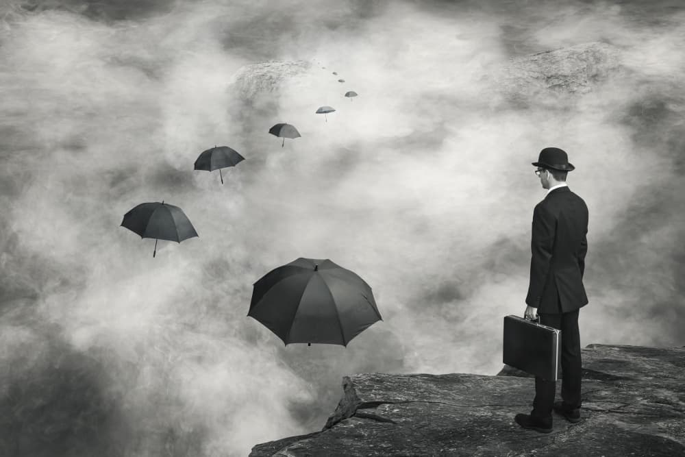 Man and Floating Umbrellas
