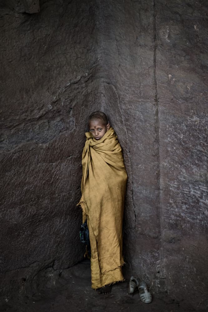 Child Monk Stone Corner by Trevor Cole — canvas wall art