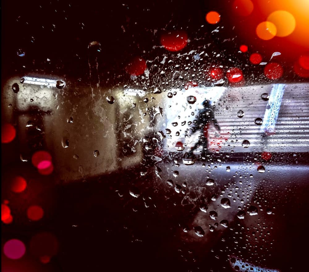 Rainy Urban Bokeh Walk by Mirela Momanu — canvas wall art