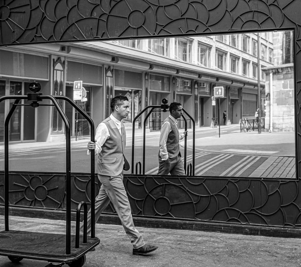 Urban Bellhop Reflection by Stephane Navailles — canvas wall art