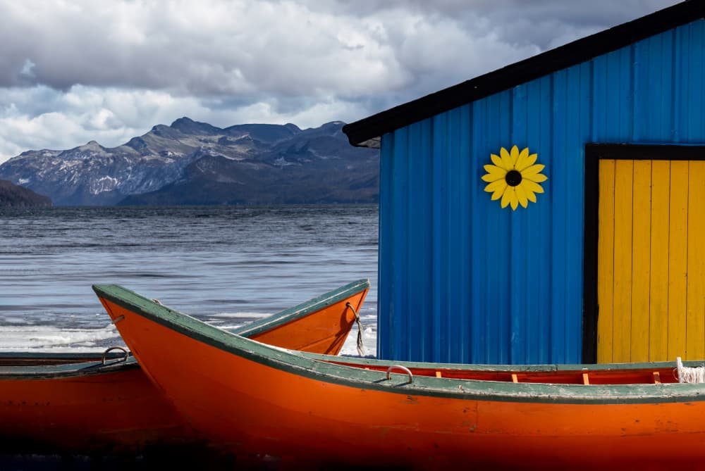 Colorful Lakeside Boathouse by Kimberly — canvas wall art