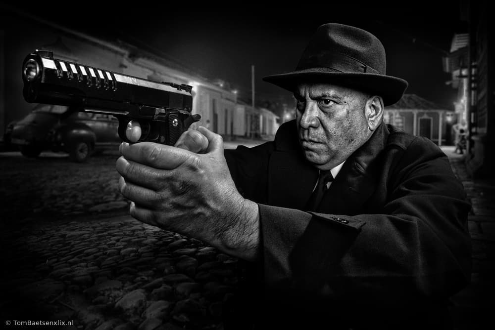 Noir Man Aims Pistol by Tom Baetsen - xlix.nl — canvas wall art